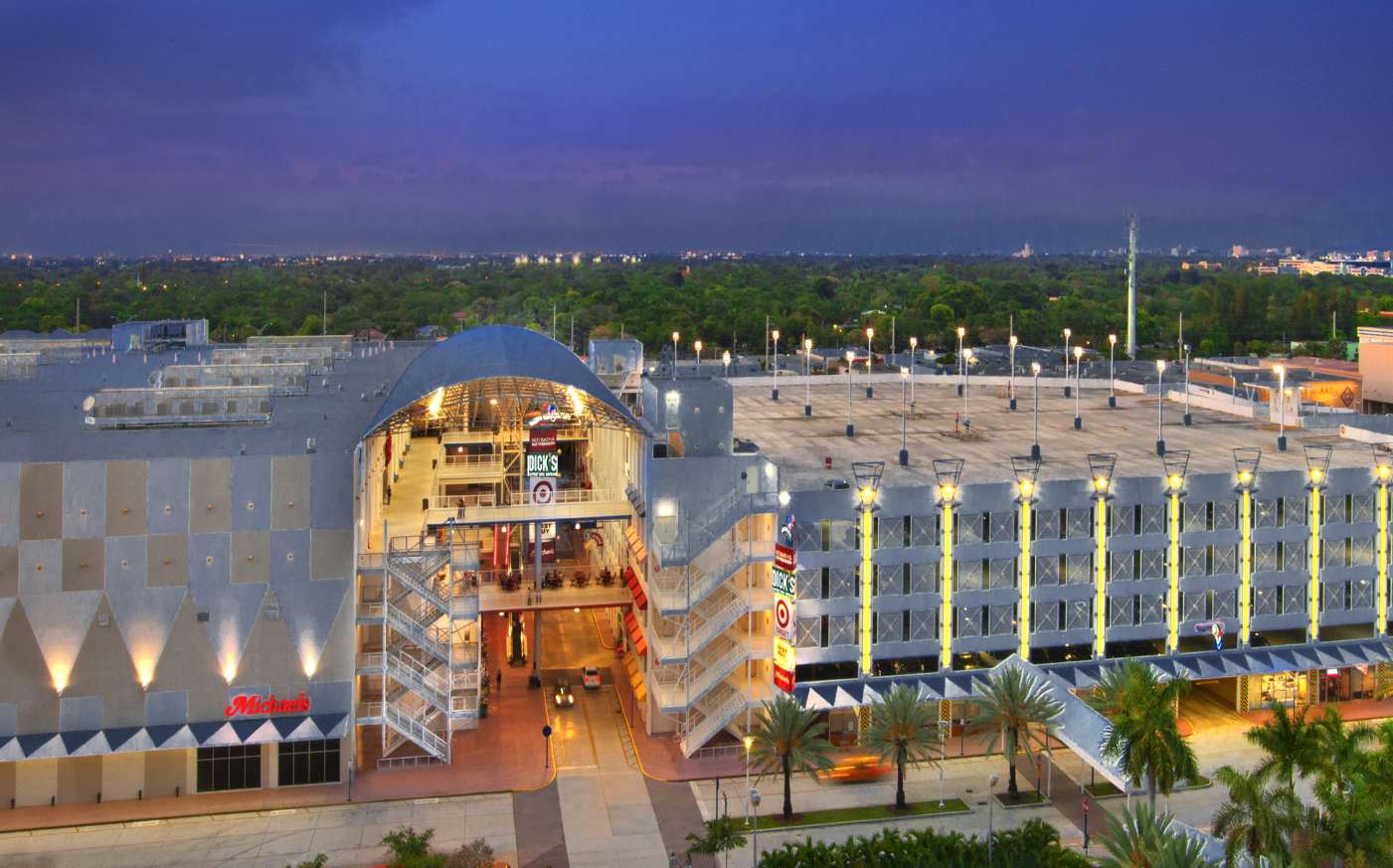 aerial view of a mall lit up in the nighttime